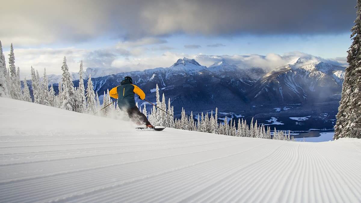 A skier going down a groomed run at Revelstoke in Alberta, Canada
