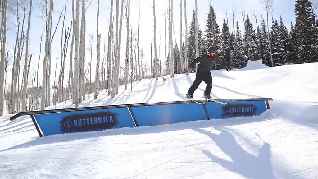 Skier riding a rail at the terrain park at Buttermilk in Colorado