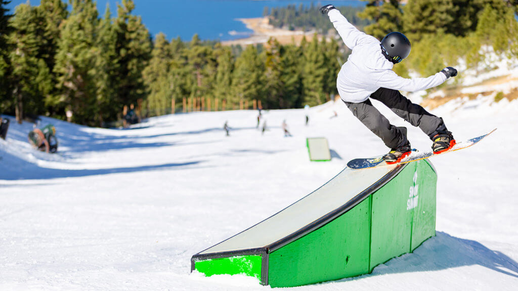 Snowboarder on a box at the terrain park at Snow Summit in California