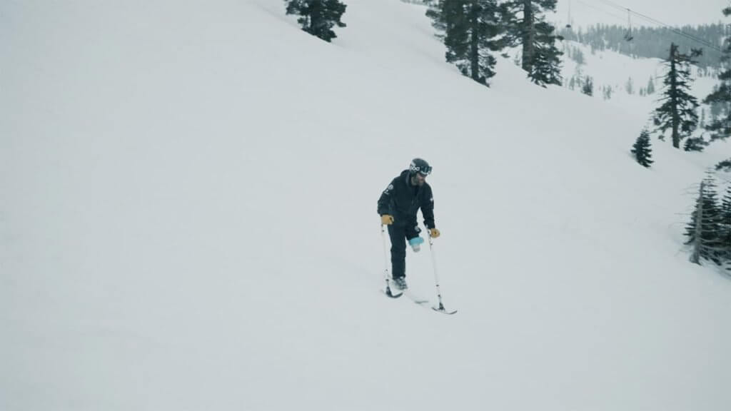 Adaptive Athlete Phil Quintana mono-skiing at Palisades Tahoe