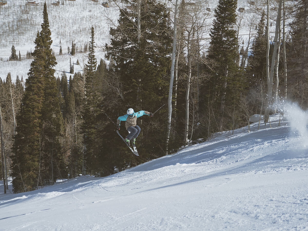 Skier performing a trick on a trail at Solitude Resort