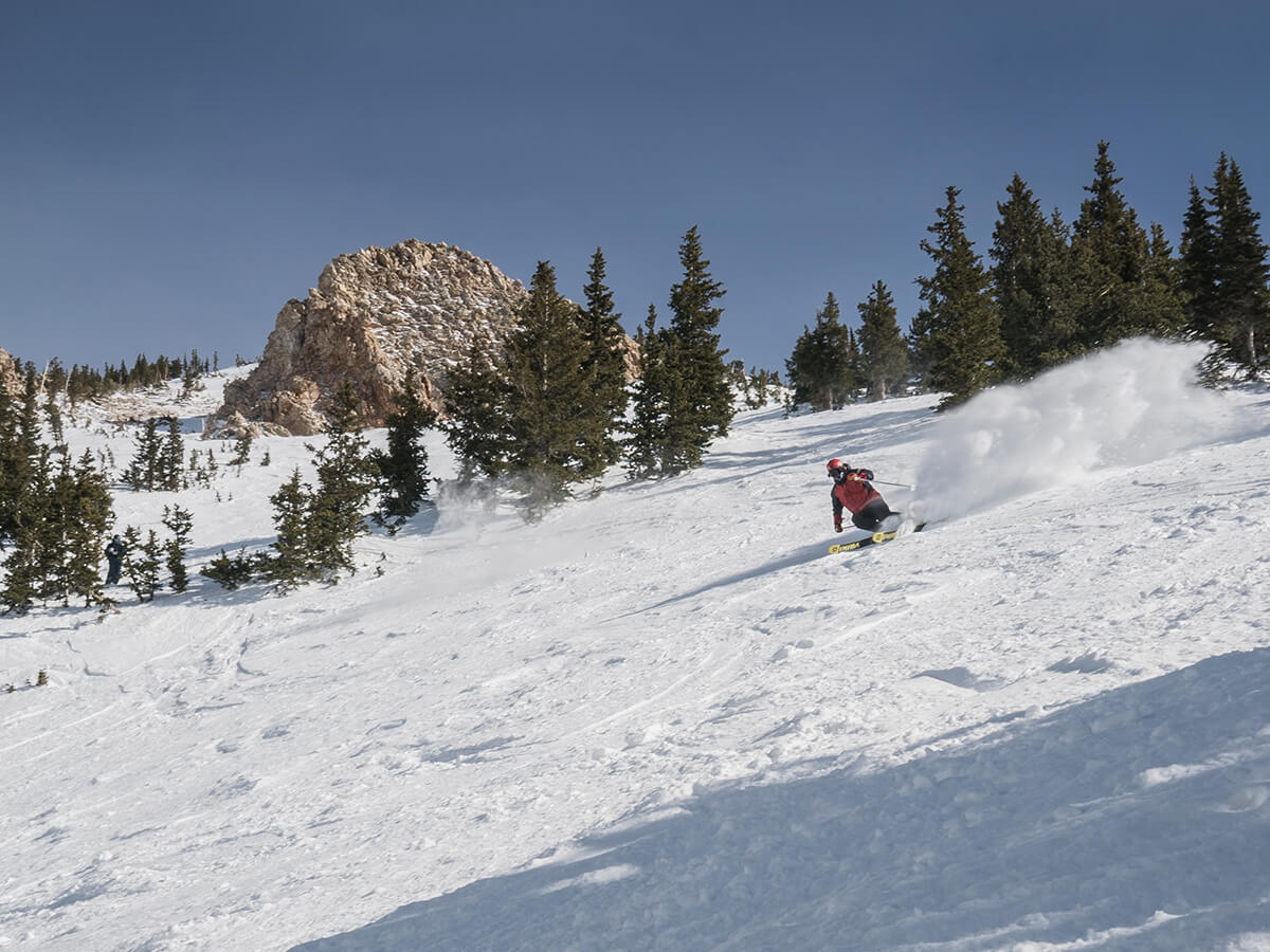 Skier on wide open slopes at Snowbird