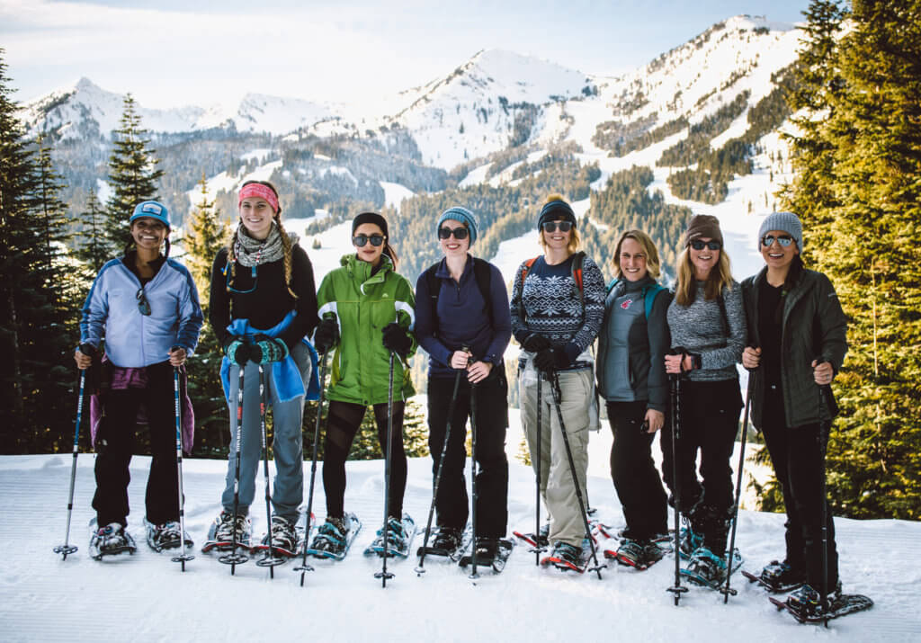 A group of women snowshoeing at Crystal Mountain.