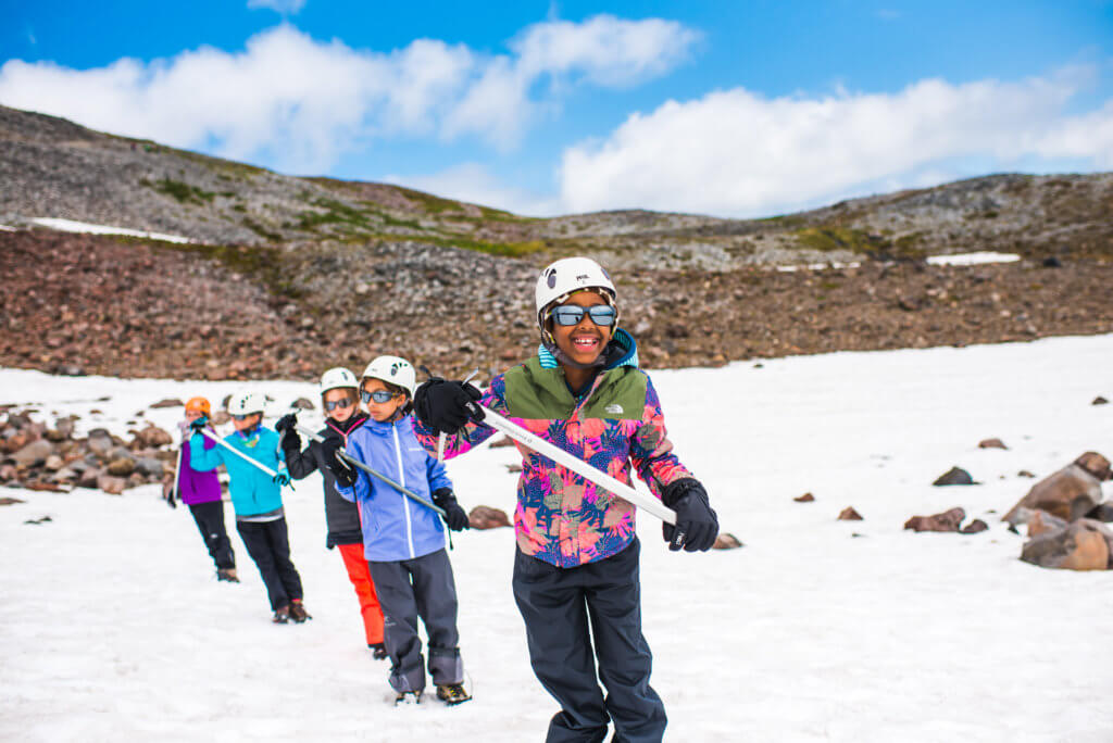 Young girls learning mountain survival skills
