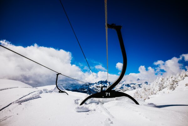 A ski lift completely buried by snow