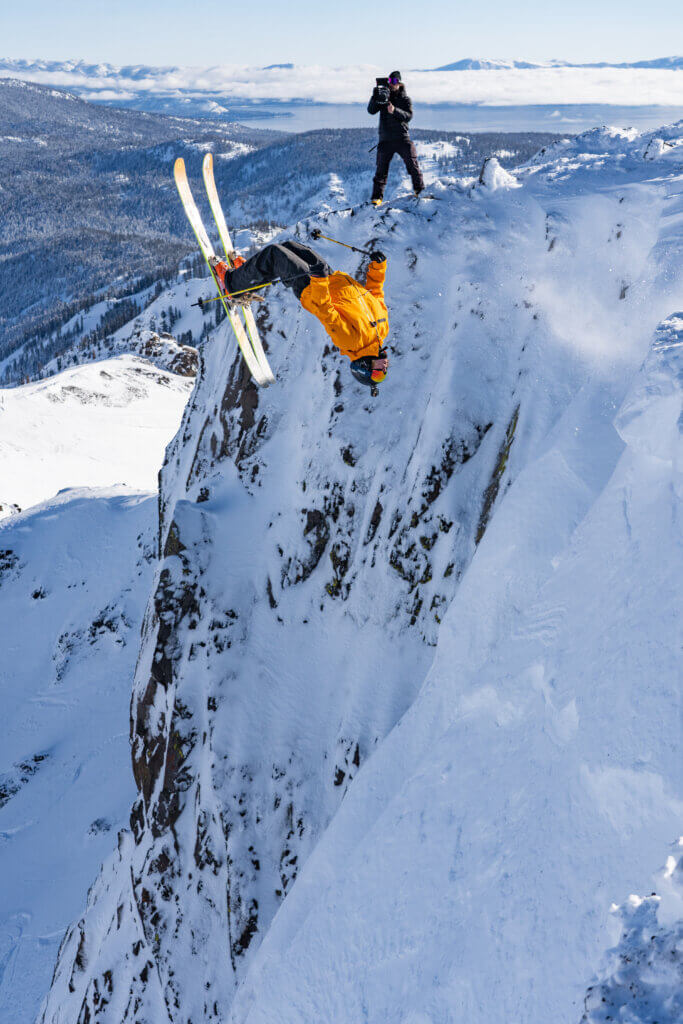 Skier mid-air doing a flip.