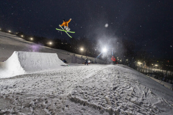 Skier performing a trick at night.