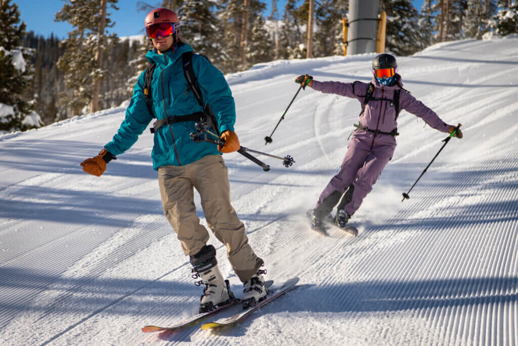 Scholarship recipient skis with Athlete Connor Ryan.