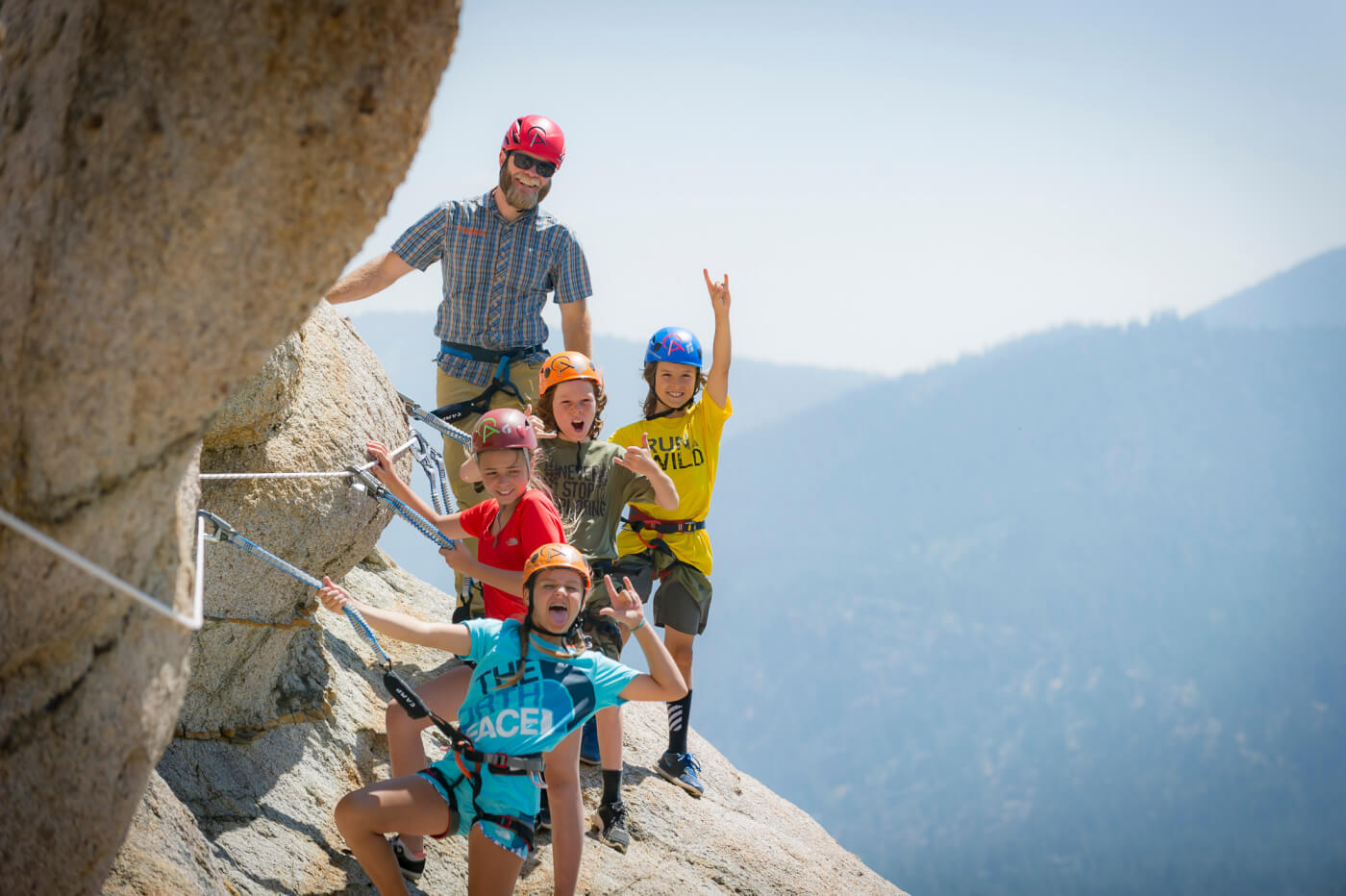 Group of children and a guide at Palisade Tahoe's via ferrata.