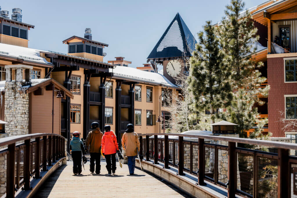 Group of people walking through Mammoth Mountain's village.