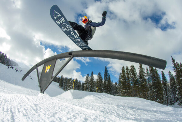 Snowboarder on a rail at Copper Mountain.