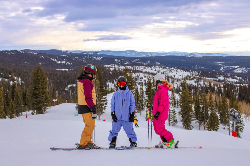 Group of people gathered on a ski trail.