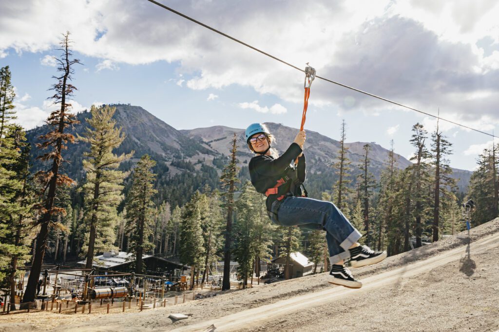 Person on a zipline in the mountains