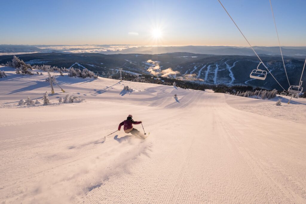 person skiing at Sun Peaks at sunrise