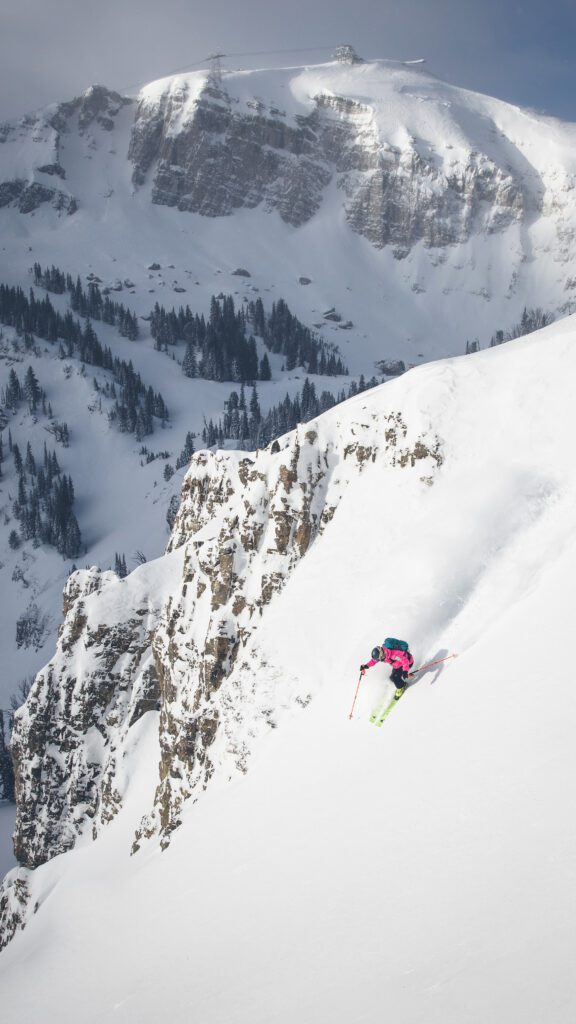 person skiing steep run solo.