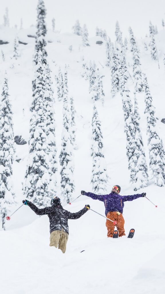 Two friends enjoying the falling snow at RED Mountain