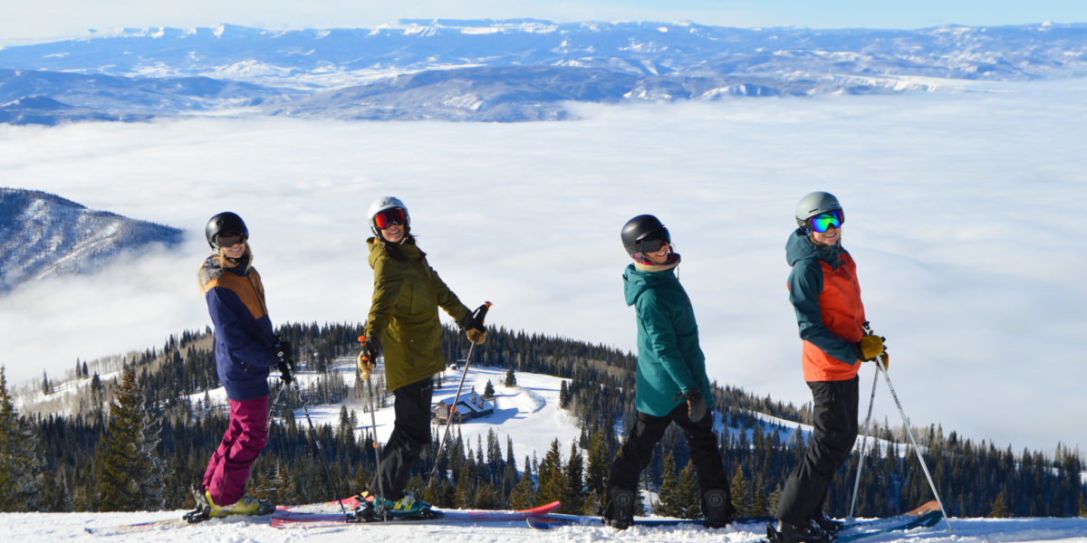 Group of best girl friends getting ready to ski down a run at Steamboat during their girls' winter vacation