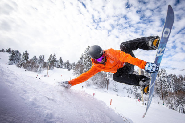 Snowboarder performing a trick at Big Bear Resort