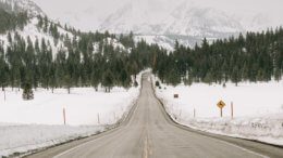 An open road in California leading to a mountain in the background