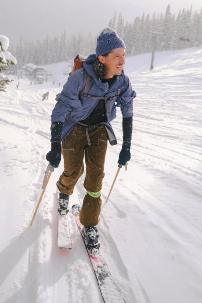 Skier skinning up the hill at Winter Park