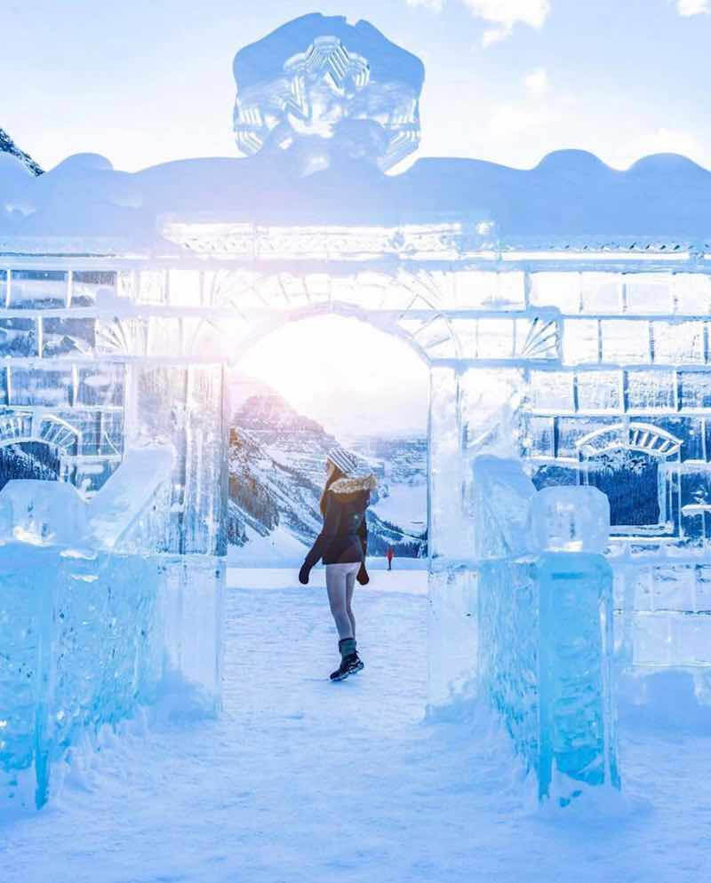Woman skating through ice castles at Lake Louise in Canada